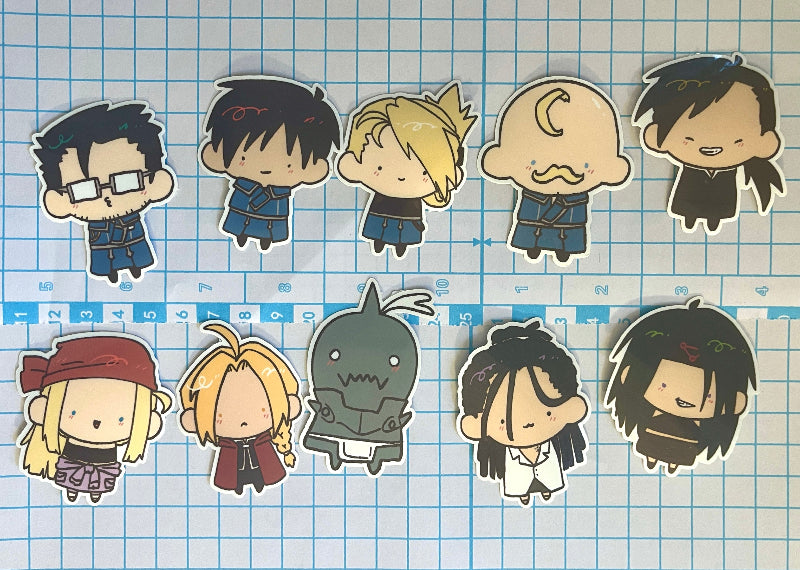 Set of cartoon character stickers on a grid background