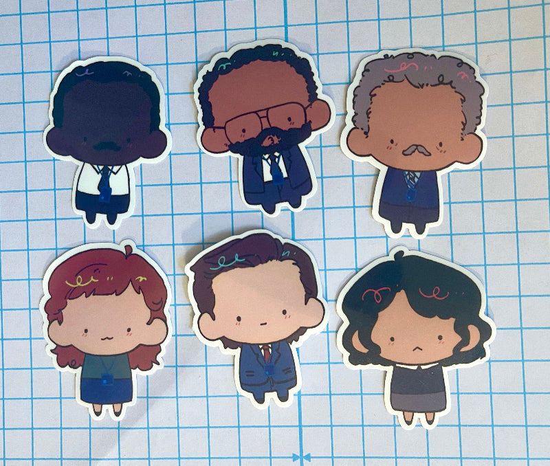 Cartoon-style character stickers on a grid background