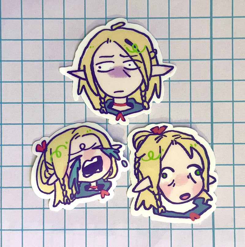 Three cartoon character stickers on a grid background